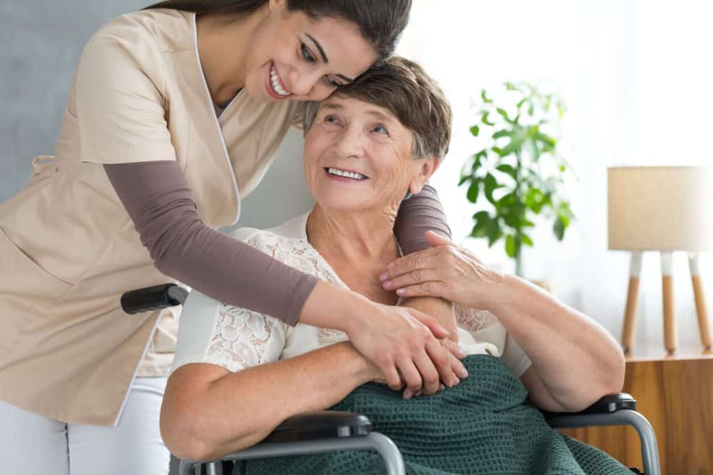 Elderly women with home aide at home