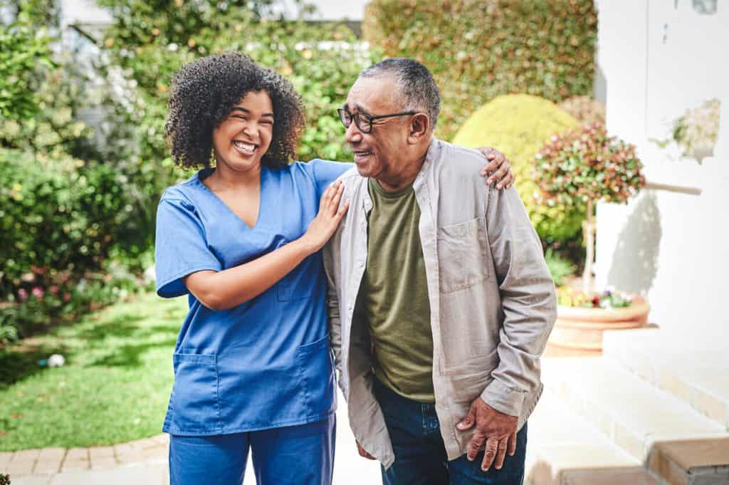 senior caregivers jobs, a young caregiver spending time with an older adult 2022