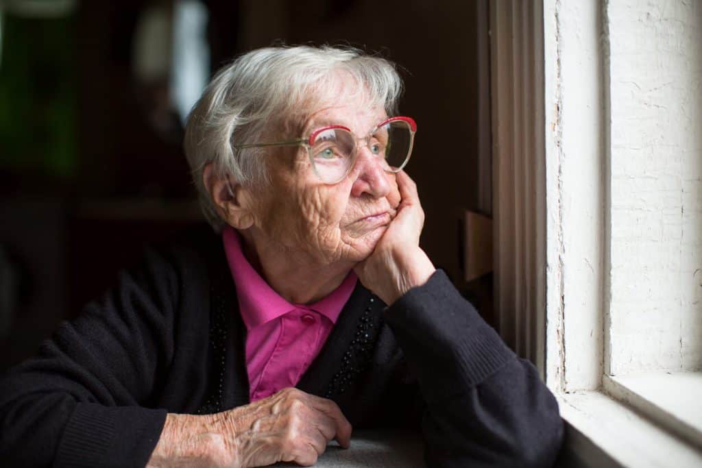 elderly woman patients staring out the window needs care services 2023 24 hour nursing care at home