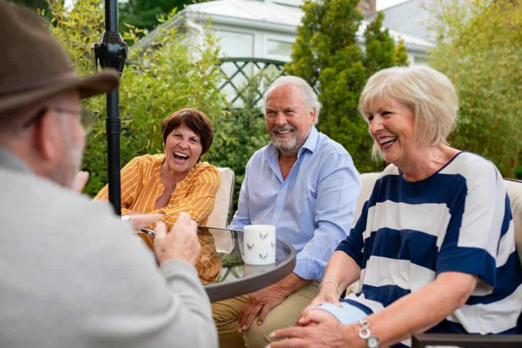 friend having a laugh before having fun outdoor activities for seniors