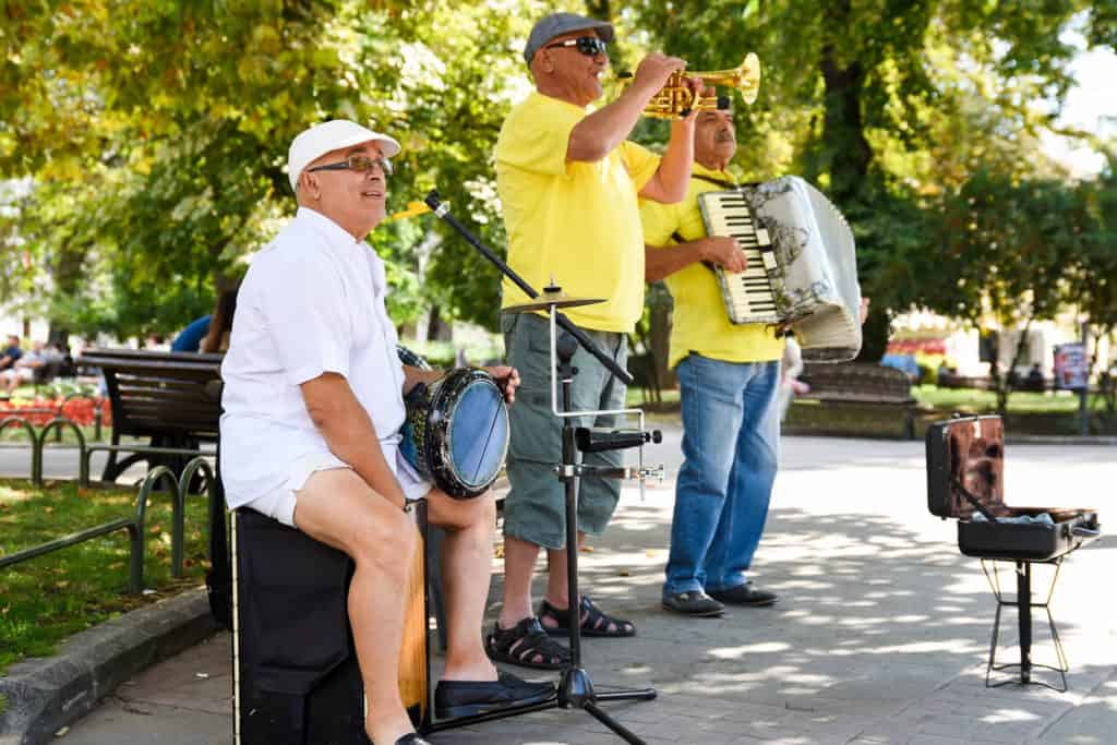 seniors having outdoor fun as they play musical instruments. outdoor activities for seniors