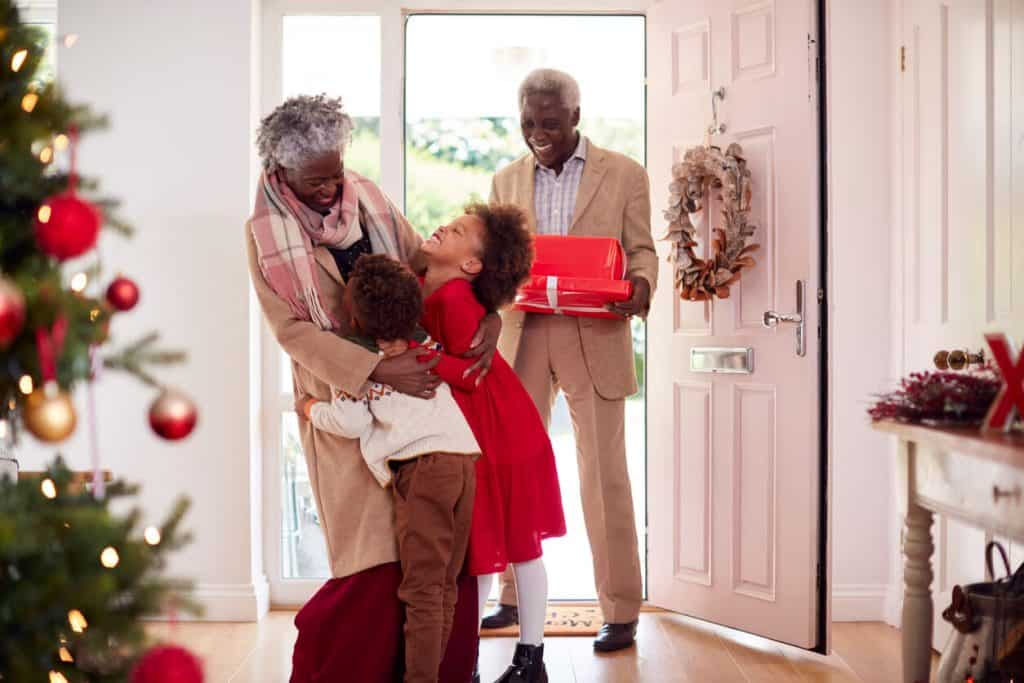 Grandchildren visiting with gifts for their grandparents day mission 2022, elderly help, elderly help