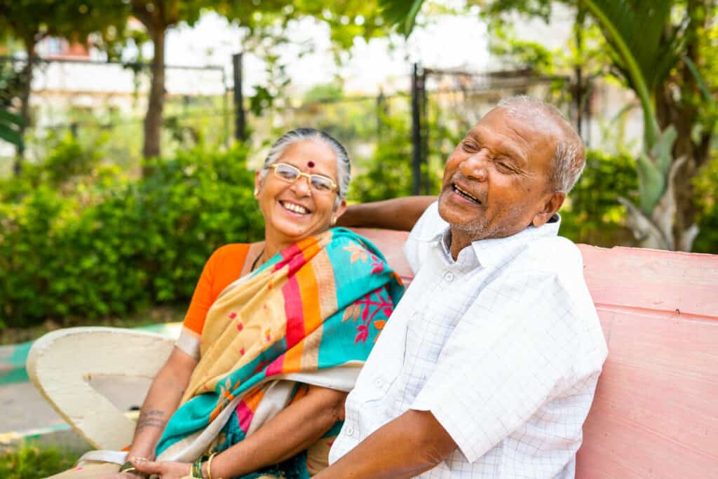 a happy couple enjoying quotes on aging and beauty at a park