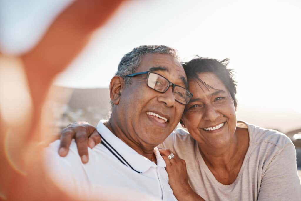 a happy couple making new memories at the beach