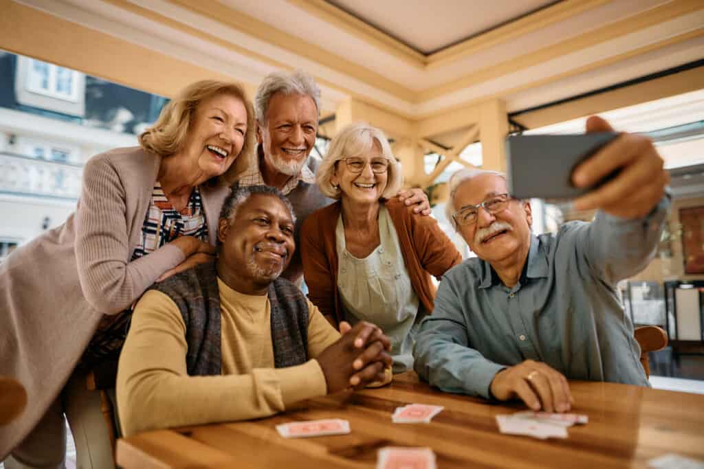 seniors taking selfie after sharing quotes on aging and beauty