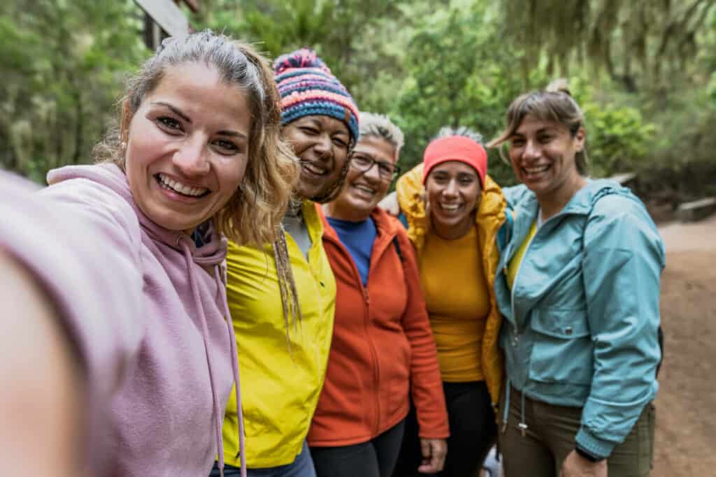 a group of women having fun outdoors while chasing their dreams
