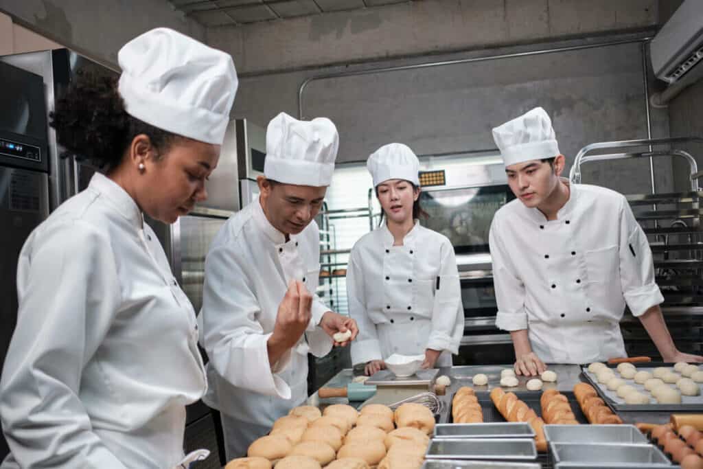 A group of friends enjoying taking a bakery class in 2023 |chasing your dreams