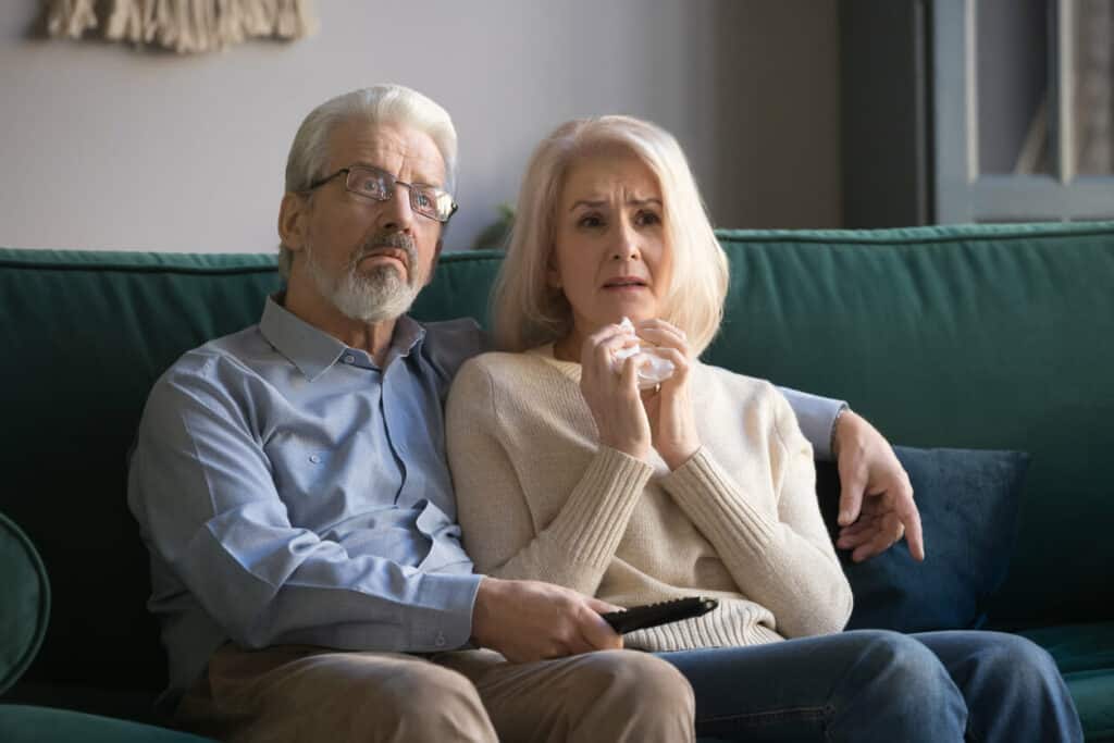 A senior couple watching too much TV.