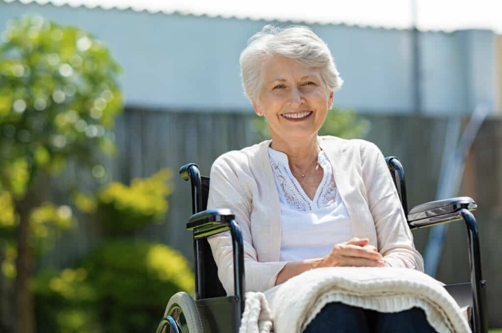 A smiling older lady enjoying the comfort of elder care equipment