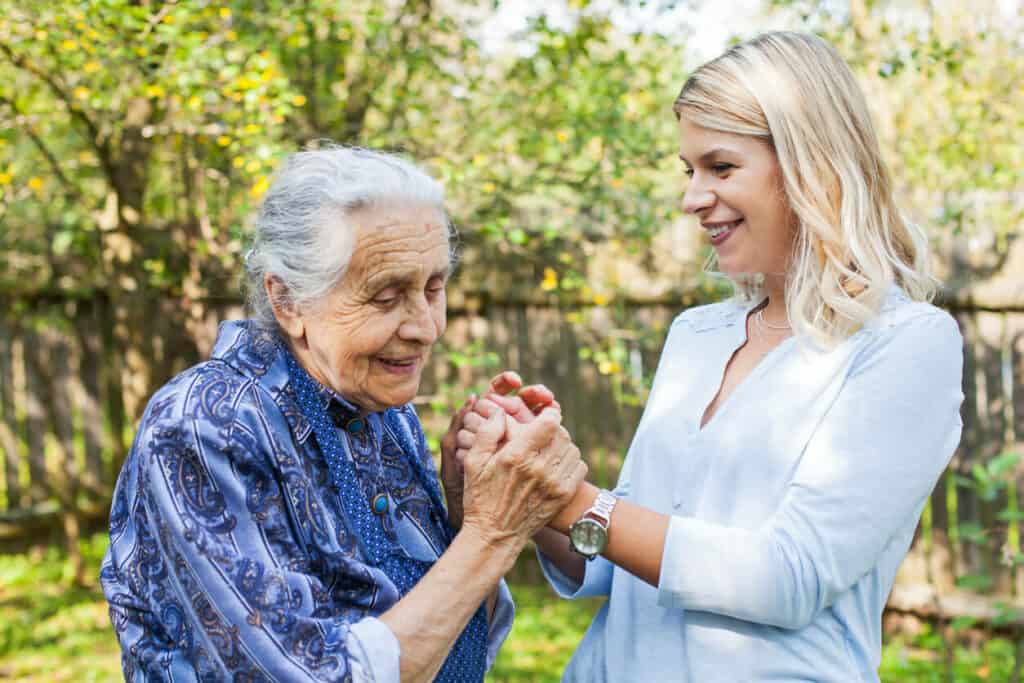 Family caregiving roles and impacts - a daughter and mother spending time together on National Caregivers Day