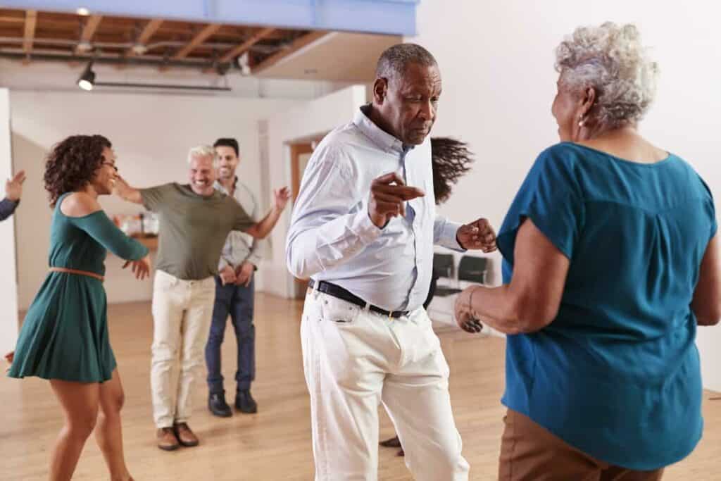 a group of seniors during a dancing exercise