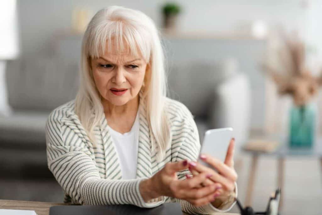 a senior woman who is a victim of a scammer.