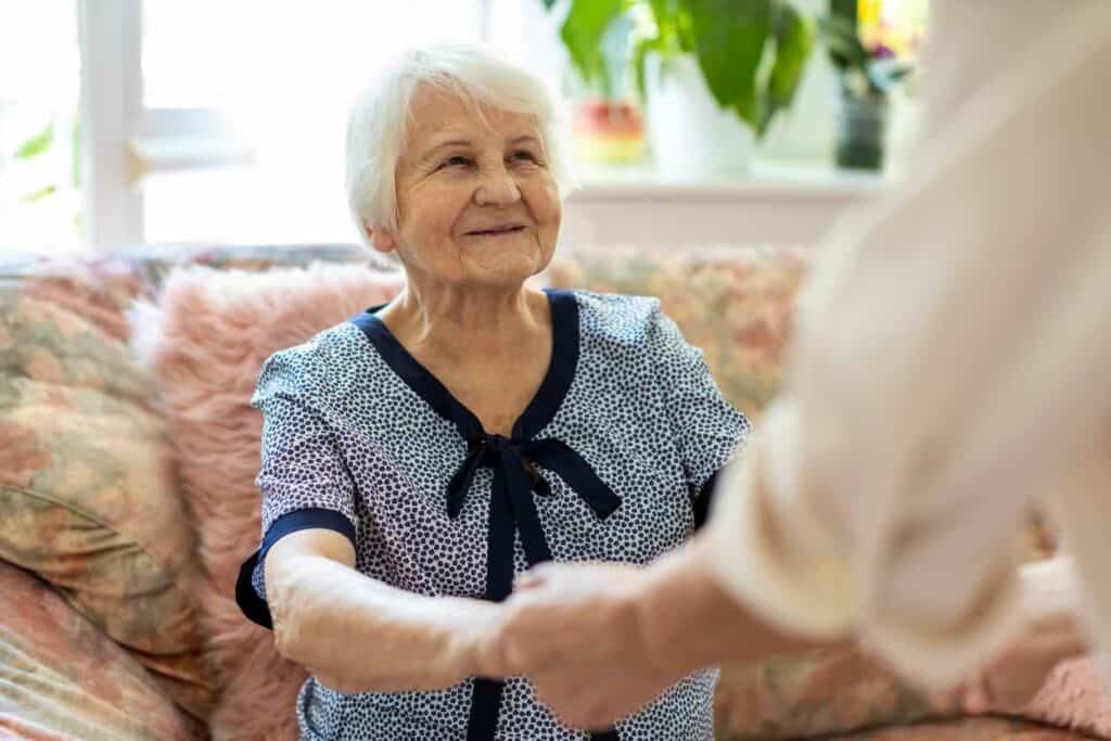 Female caregiver supporting an older woman in assisted living in Carson City | carson city assisted living