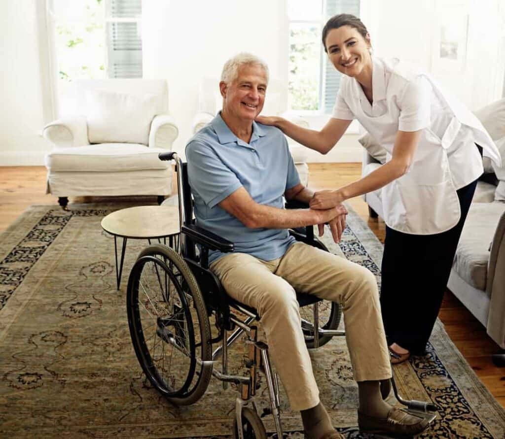 A nurse helping a senior man after surgery with in home health care.
