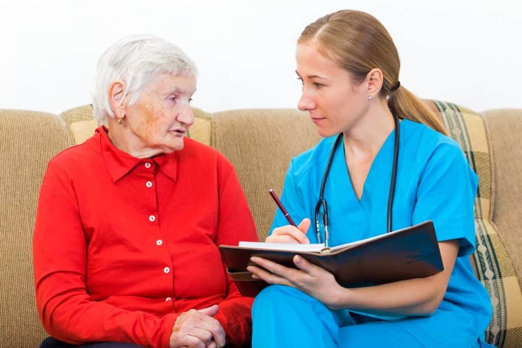 Doctor assessing female dementia patient - seven stages of dementia