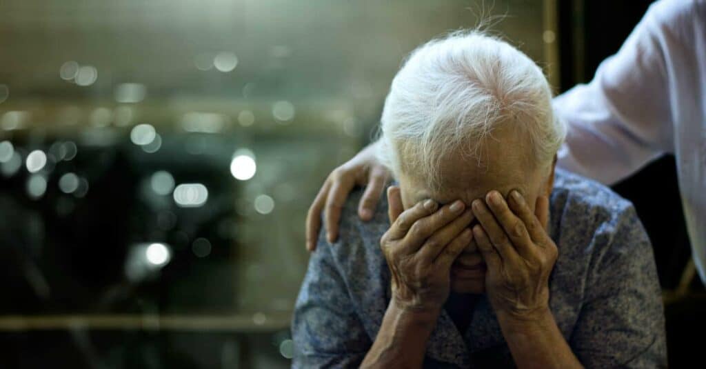coping with sundowning in the elderly - a daughter comforting her mom