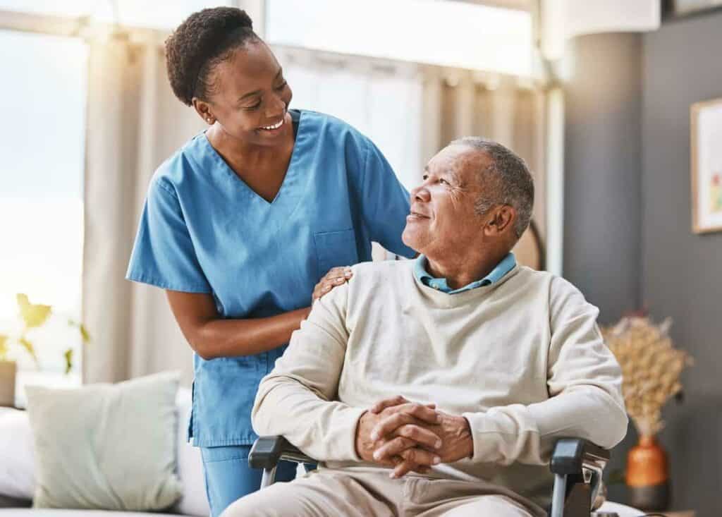 a caregiver helping an older man in an assisted living home