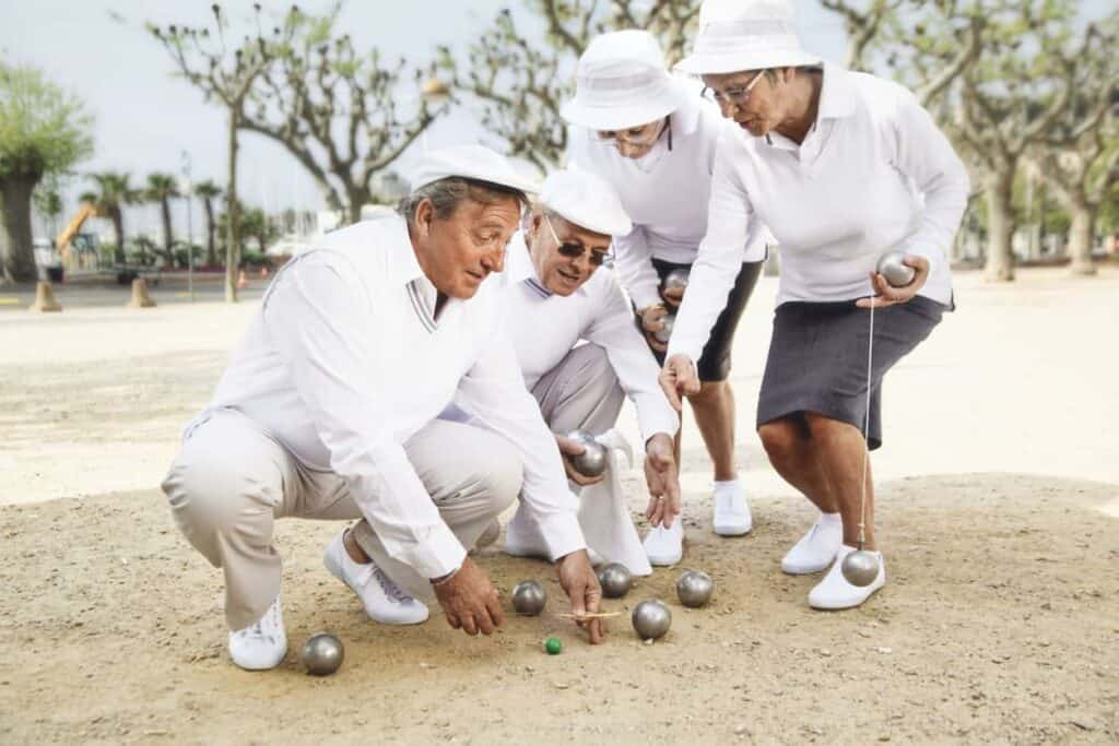 Seniors playing petanque as they did when they were young | Dragonfly meaning and symbolism