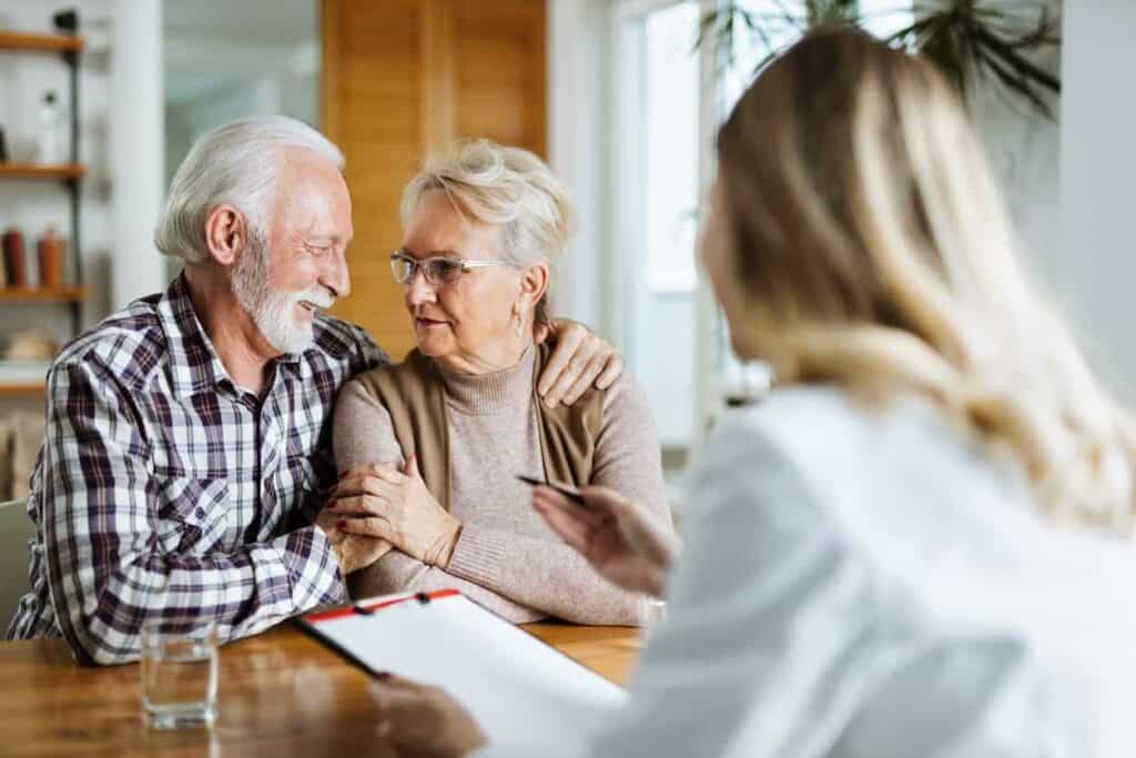 A senior couple discussing with their doctor if they are eligible for Medicare home health care
