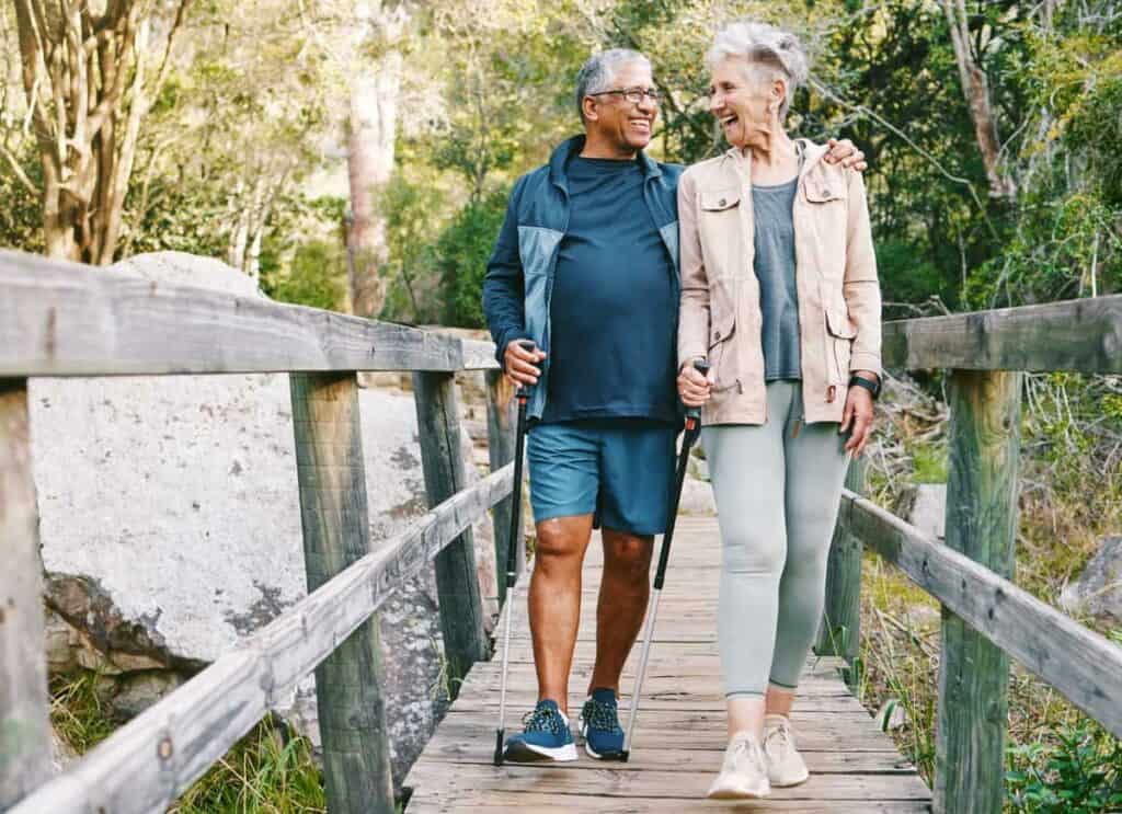 a senior couple enjoying a walk around their neighborhood