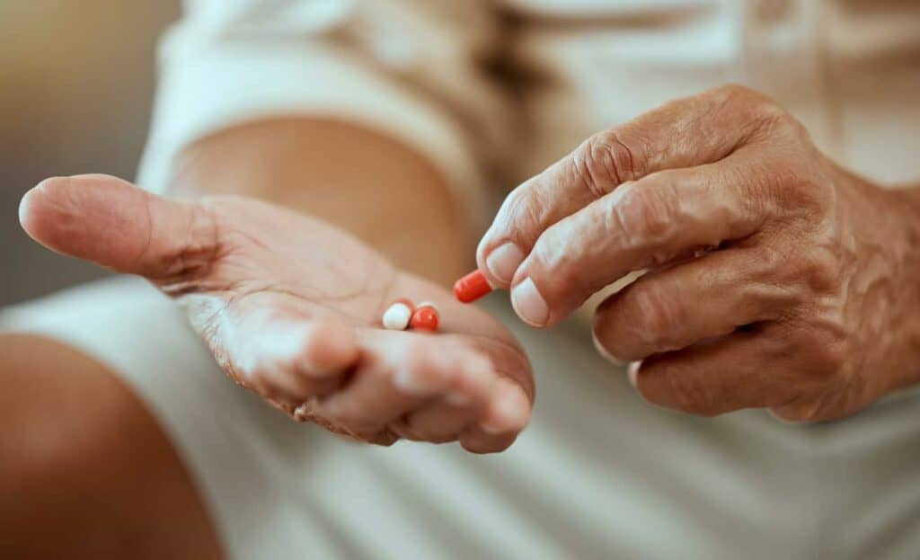 An older patient receiving some pain relief medications
