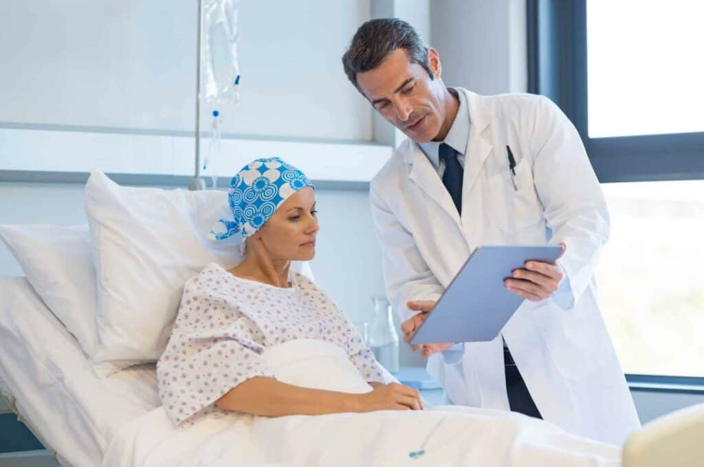 an oncologist explaining to a patient her treatment options