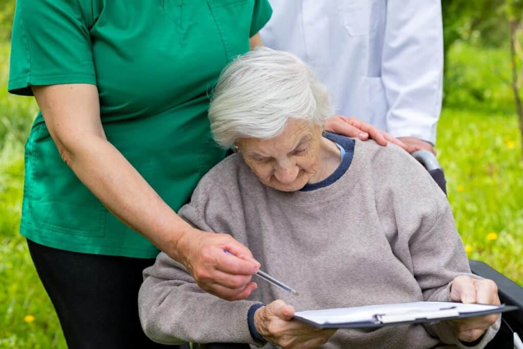palliative care members assisting a senior in decision-making