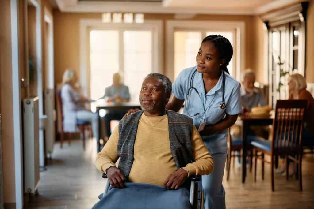 senior man receiving palliative care in an assisted living home