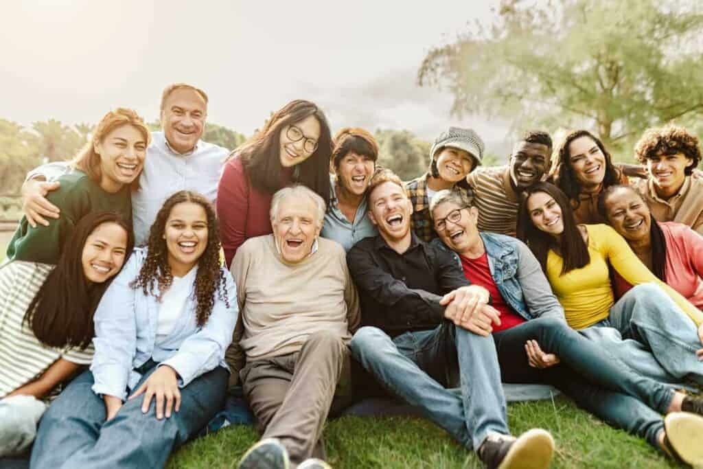 a group photo of a senior, their healthcare providers, and family spending some quality time together