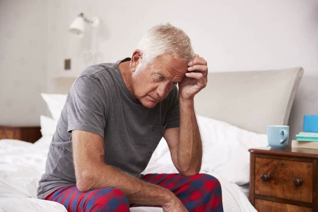 elderly man facing depression from a serious illness diagnosis