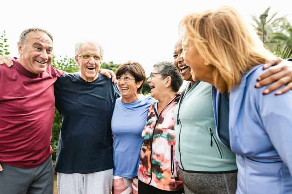 Palliative services are significantly different in their goals to hospice care. A group of seniors of different ethnicities enjoying a visit to a park in their city