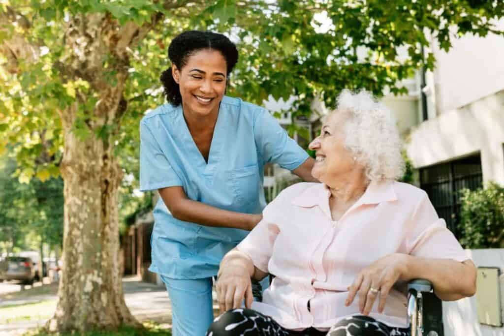 elderly lady with her personal nurse going for a walk - in home care near reno