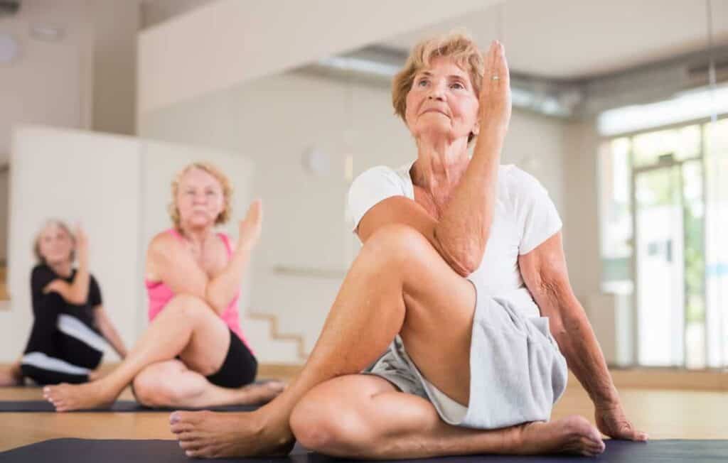 older women practicing yoga together - Dayton senior living