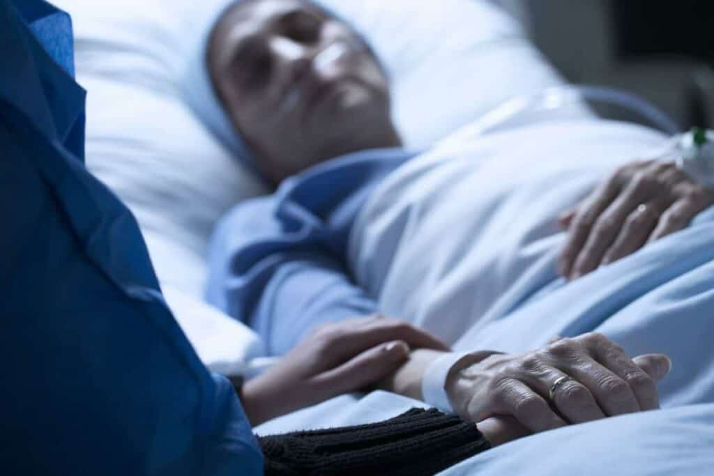 end of life hospice care - woman lying in a hospice facility