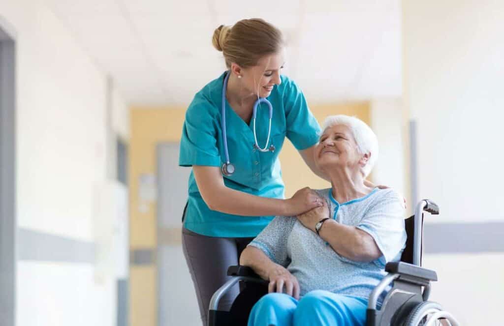 when do you call hospice for cancer - senior woman and nurse in a hospice center