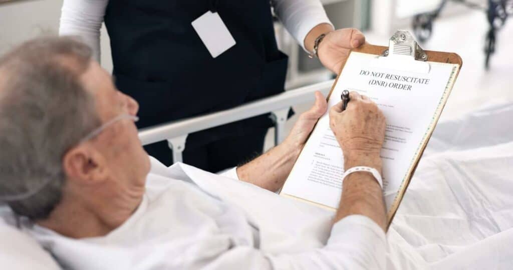 a patient signing for a live hospice program