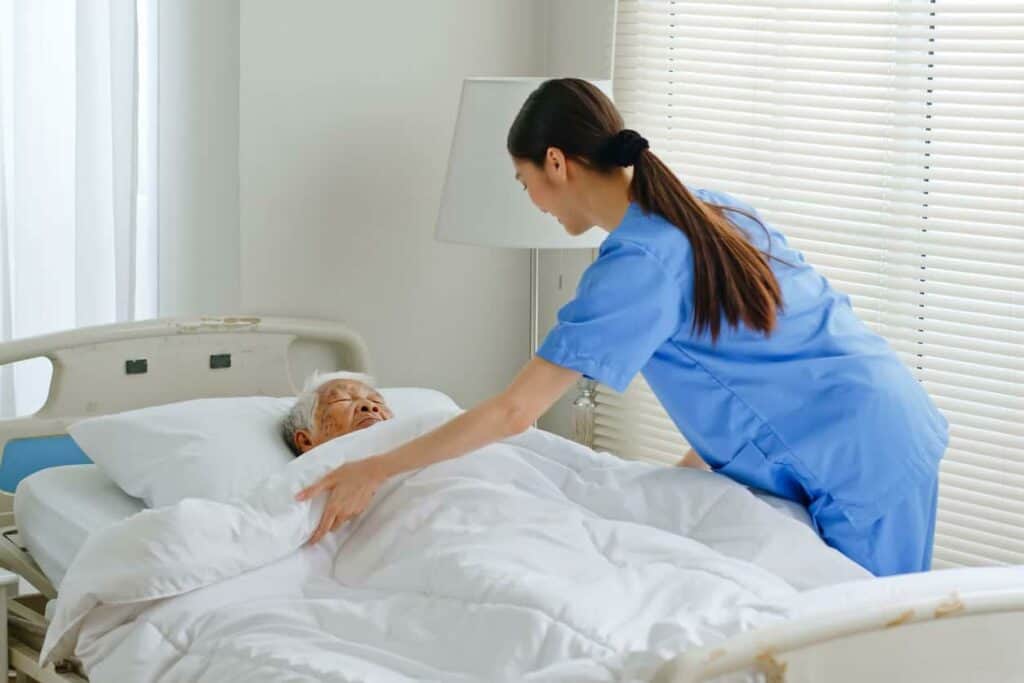 an older woman receiving round-the-clock care at a hospice facility