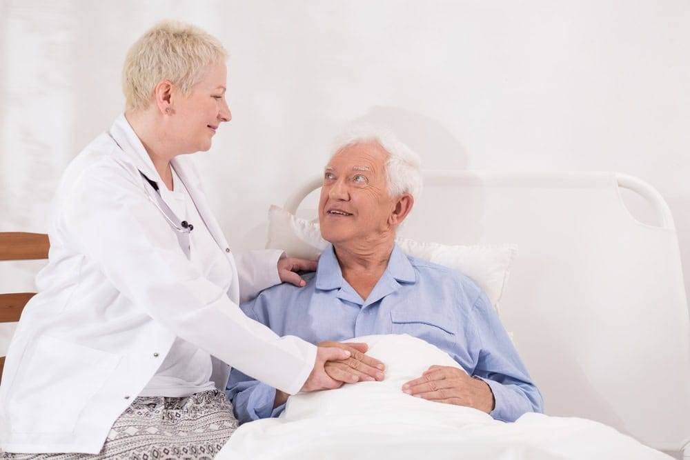a physician explaining about national hospice and palliative care to a patient