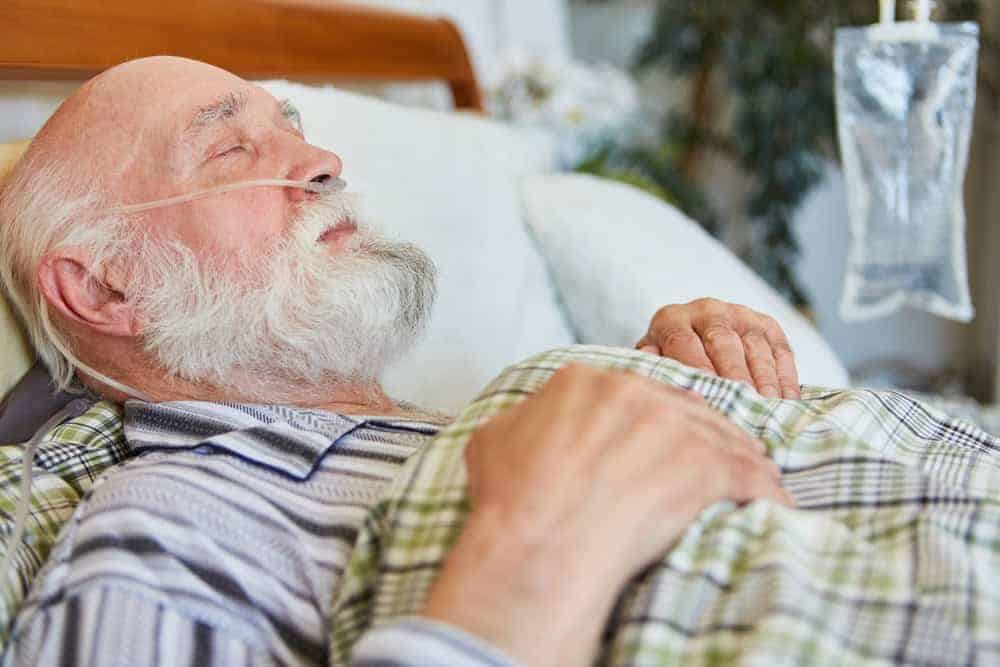 sick elderly man in hospice care