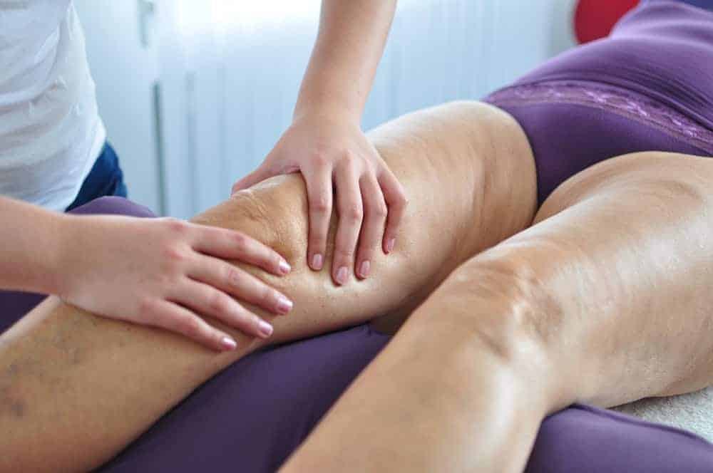 Elderly woman receiving massage as pain management therapy | what is the goal of hospice