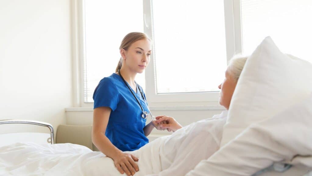 a nurse is checking the vitals of a patient near the end of life