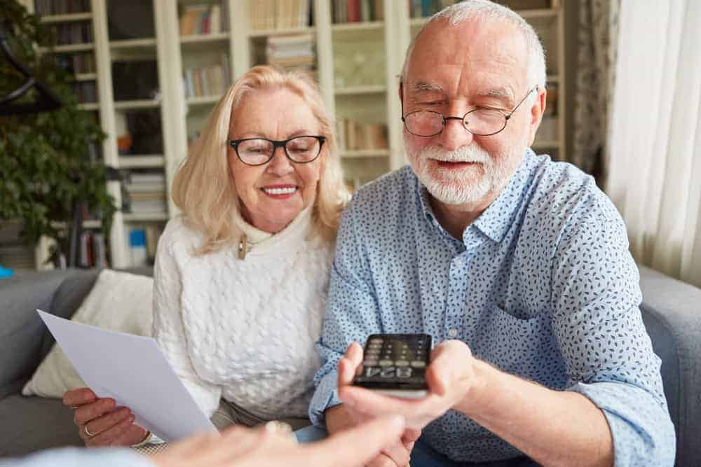 a senior couple working out the cost of memory care