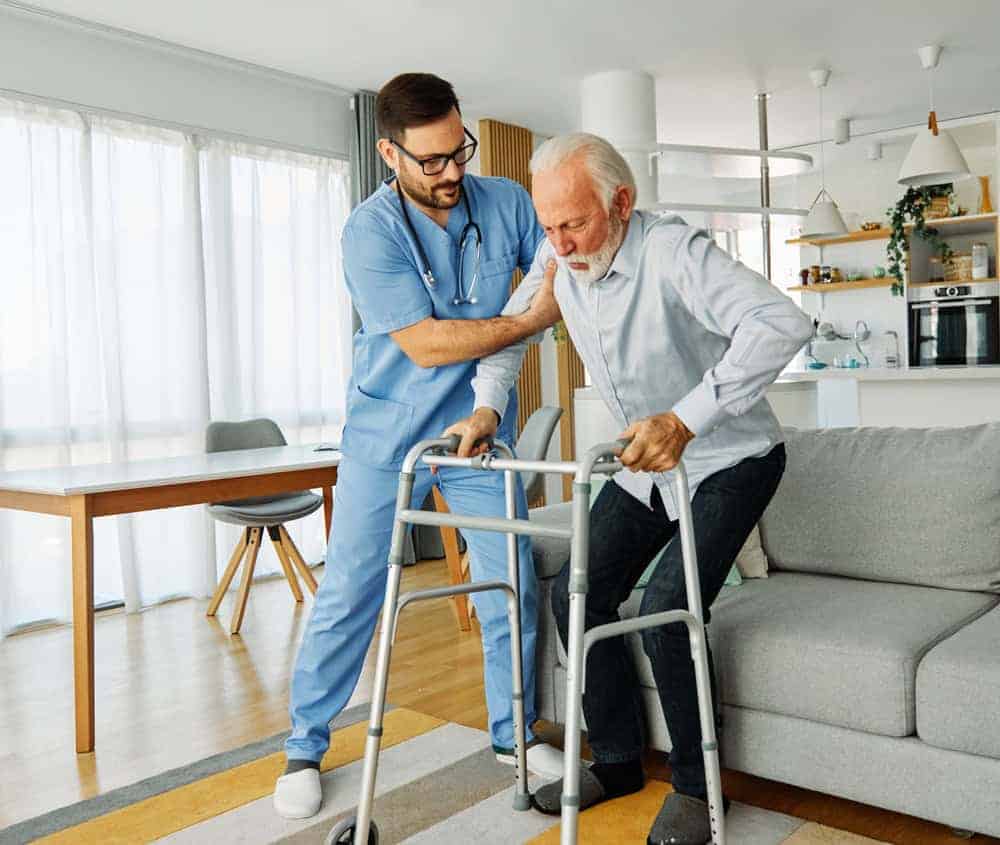 elderly man in a nursing home getting rehabilitation services| average cost of memory care