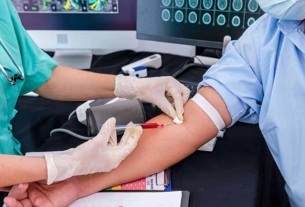 A doctor taking a blood sample