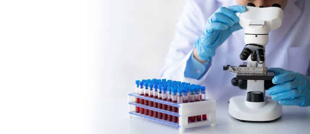 A scientist examining blood samples