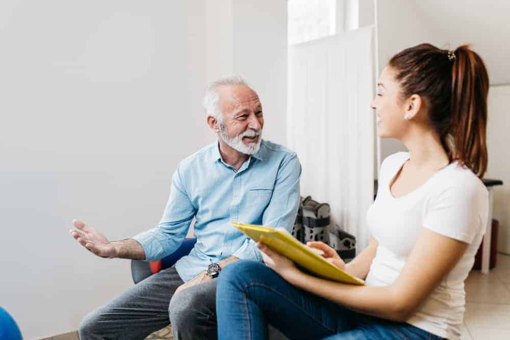 A therapist talking to a senior man about this treatment program | evaluation and treatment