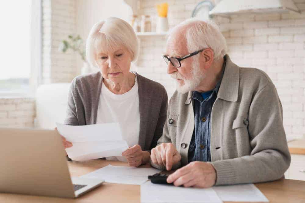 A senior couple checking their finances.