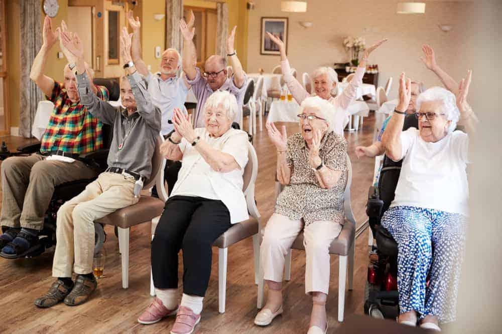 a group of seniors spending quality time at a memory care community