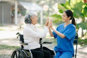 helping a senior with his daily home exercises - Nevada caregivers