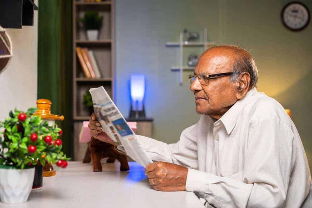 senior man reading a magazines for older people